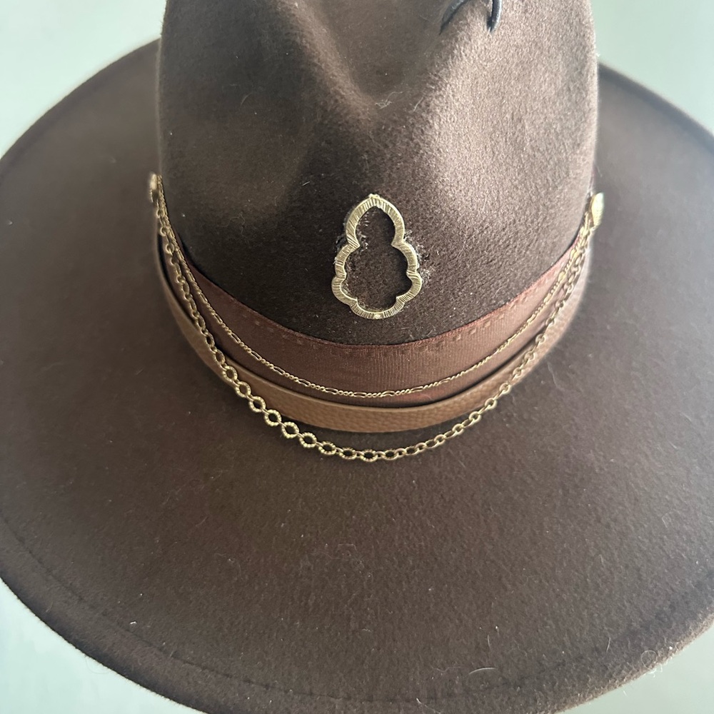 Wide-Brimmed Hat with Leather, Feather, and Gold Chain Detail